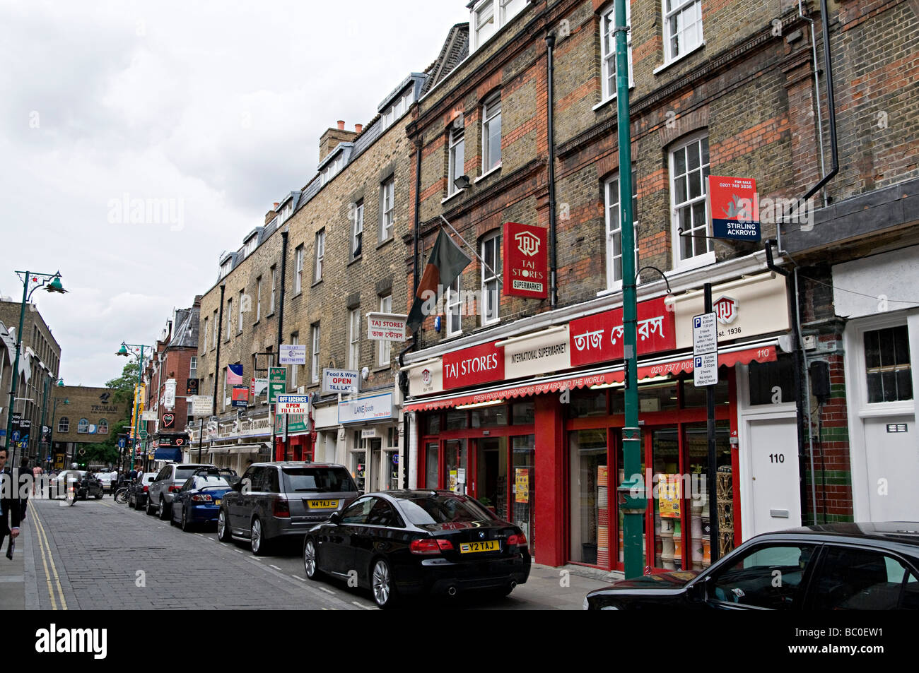 famous curry restaurant signs down brick lane in the east end of london