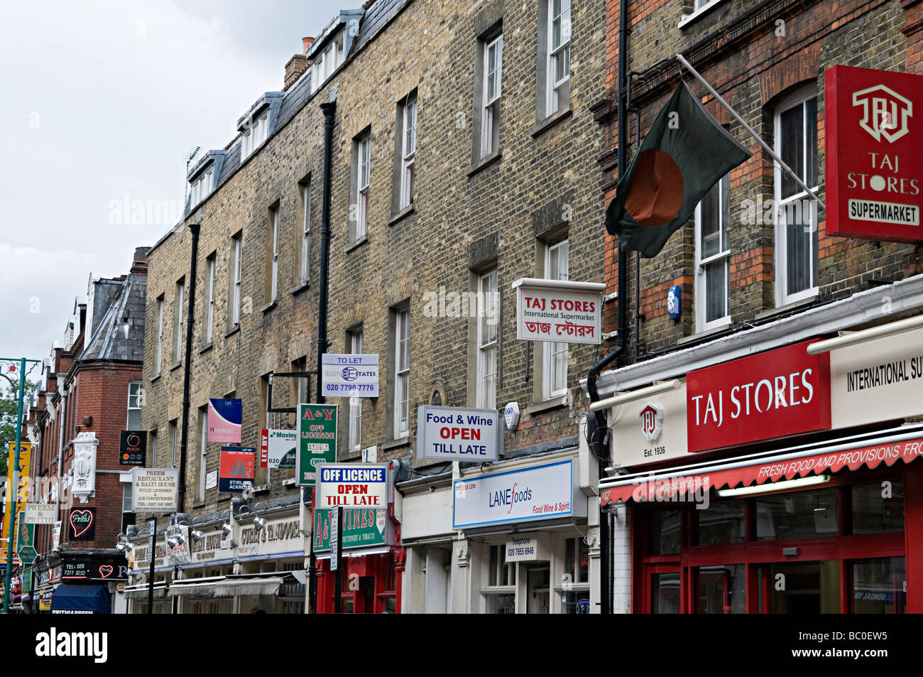 famous curry restaurant signs down brick lane in the east end of london