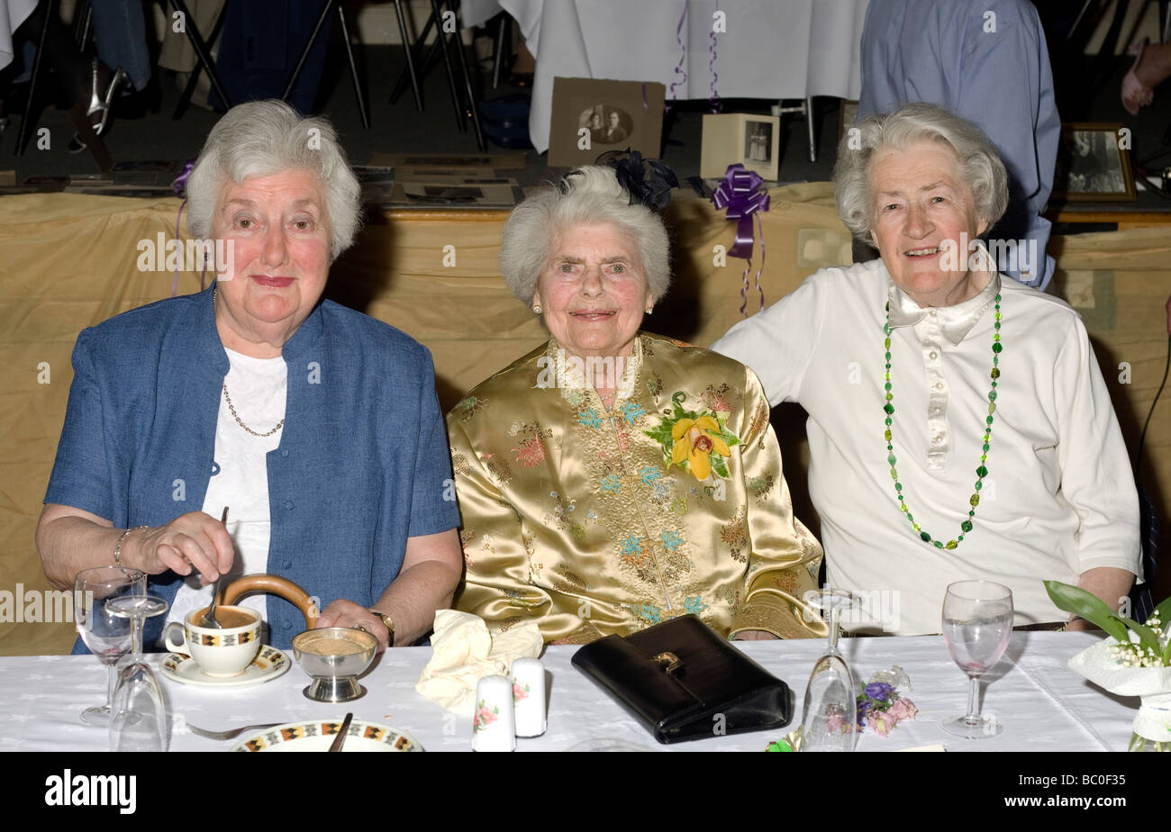 The lady in the middle was 90 the day before. Her sister (in blue) is 5 years younger and her cousin is 10 years younger Stock Photo