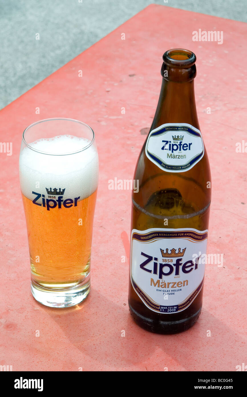A glass and bottle of Zipfer lager in a café in the Austrian Tirol