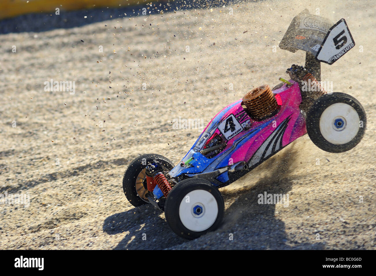 Action shot of a radio-controlled buggy racing in the European Championships. Motion blur shows the speed it’s travelling. Stock Photo