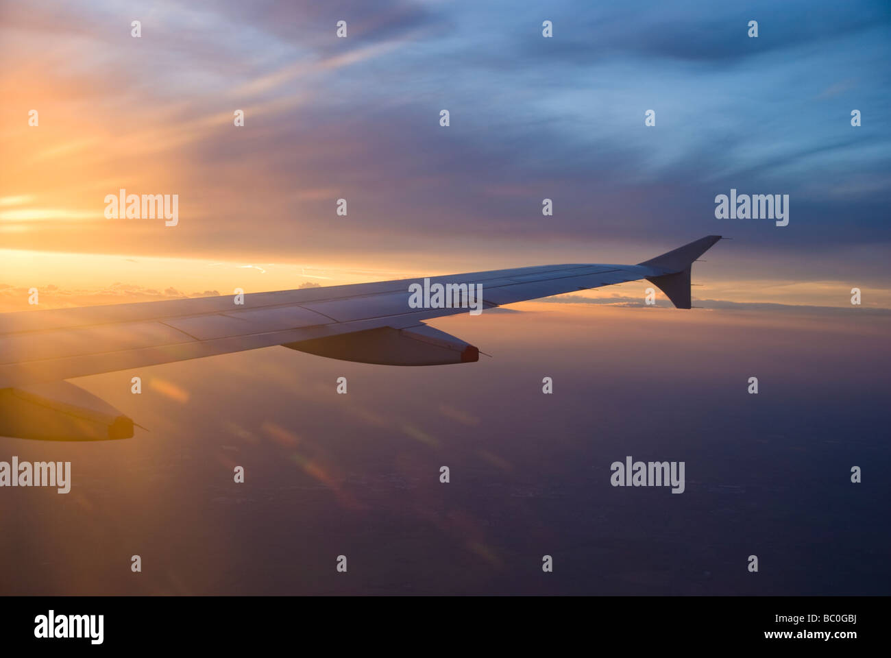 Plane wing fly window sunset hi-res stock photography and images - Alamy