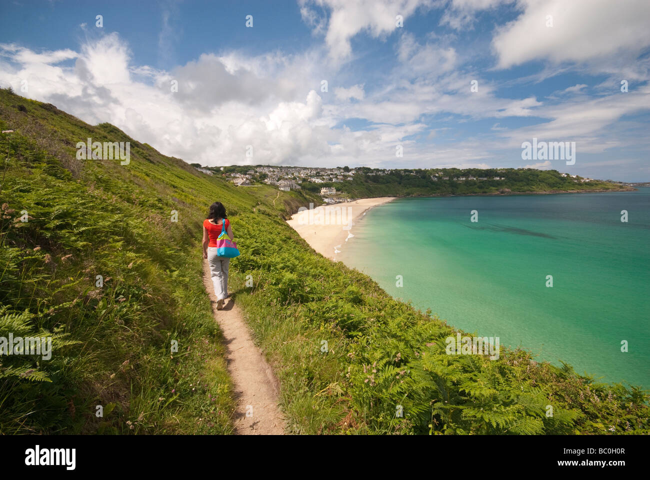 Walking along the coastal path close to Carbis Bay in Cornwall Stock Photo