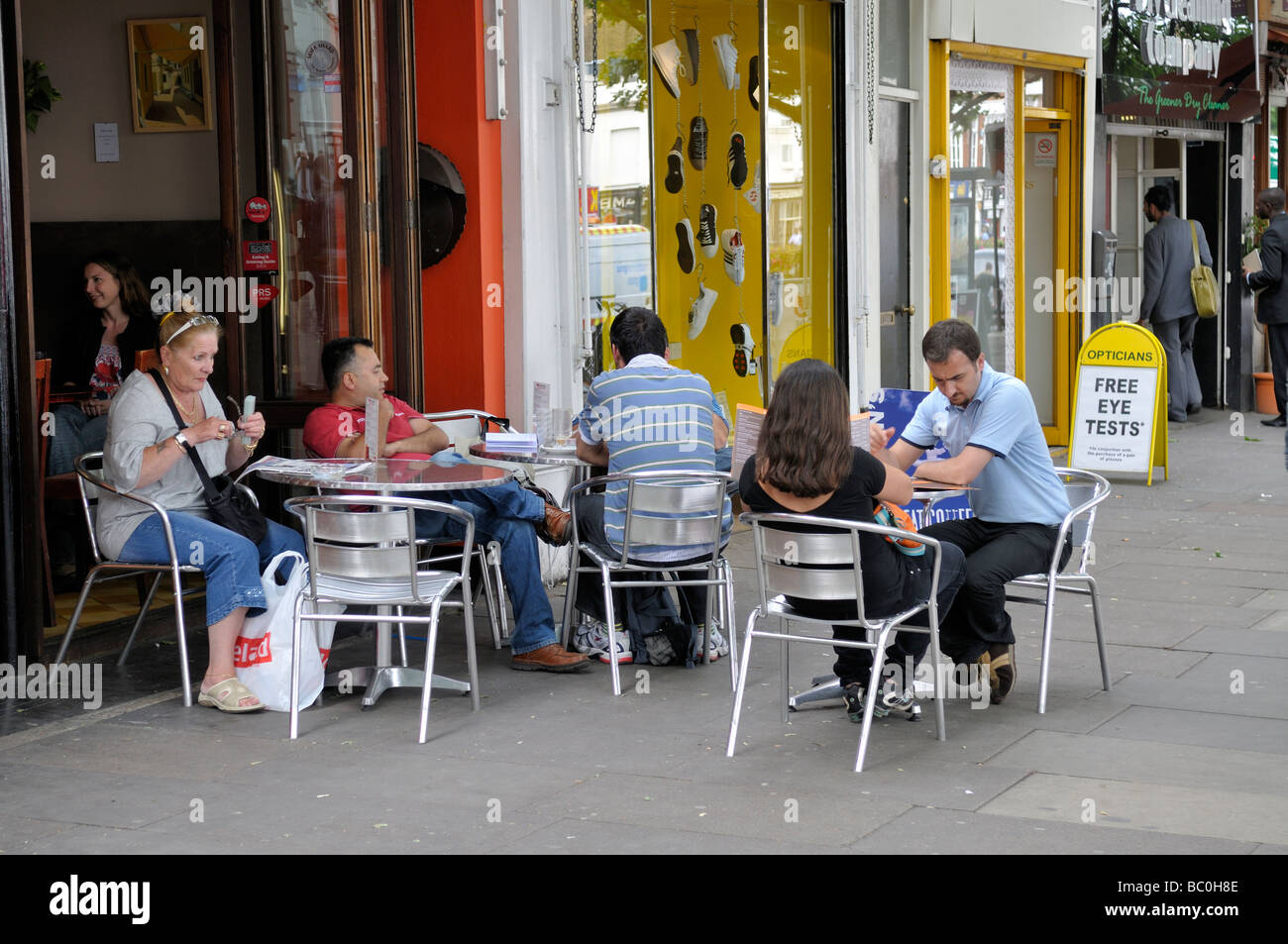 Eating outside at café in Islington London Stock Photo