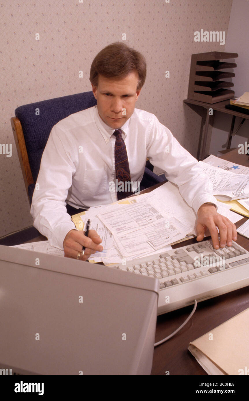 office accountant bookkeeper CPA computer tax prep support service payroll manage investment economy control Stock Photo