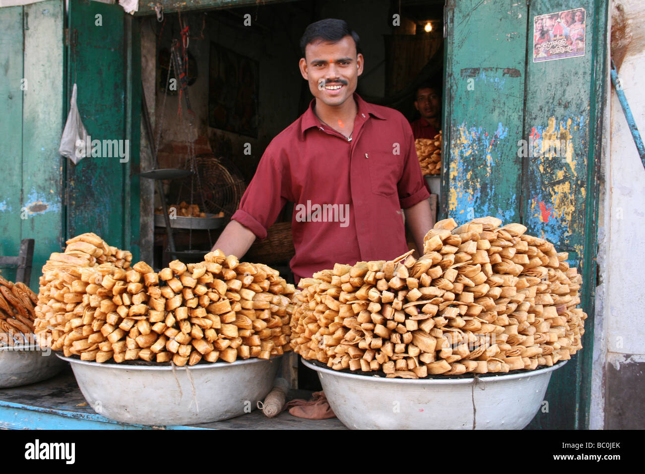 Pastry Seller On His Stall In Puri, Orissa, India Stock Photo