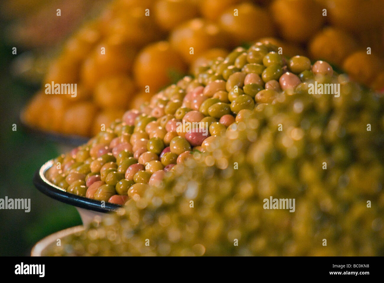 Large bowls of olives lined up inside a covered market in Marrakesh Morocco North Africa Stock Photo