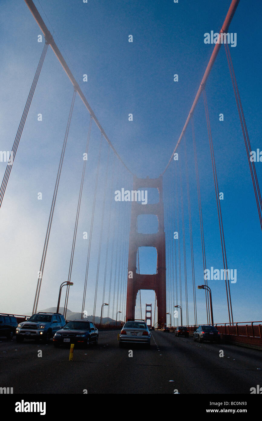 Traffic on the Golden Gate Bridge with a finger of fog stretching in towards the Bay. Stock Photo