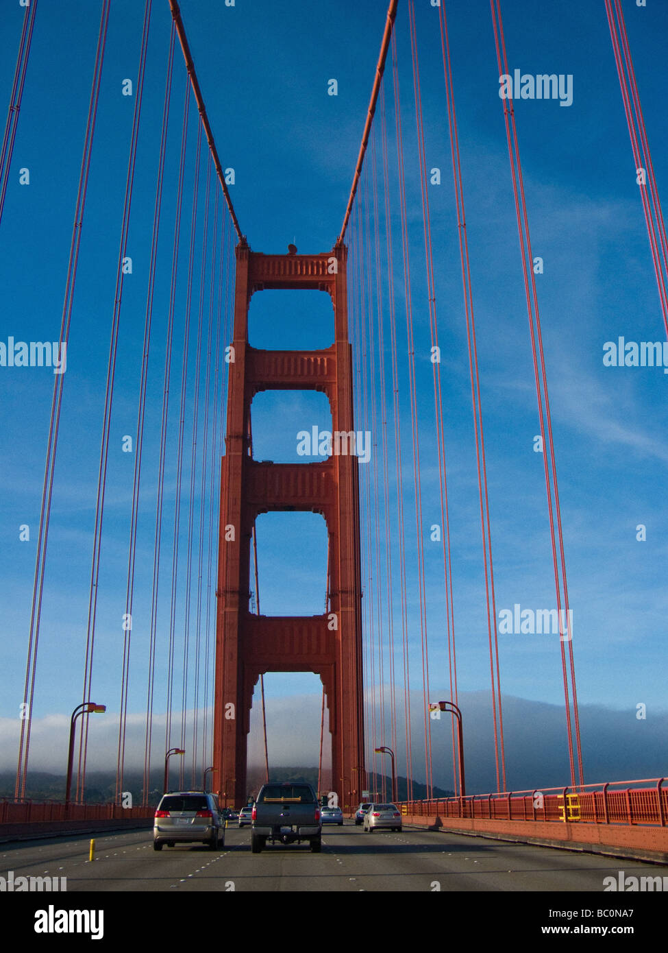 Traffic on the Golden Gate Bridge with a fog bank in the background over Sausalito. Stock Photo