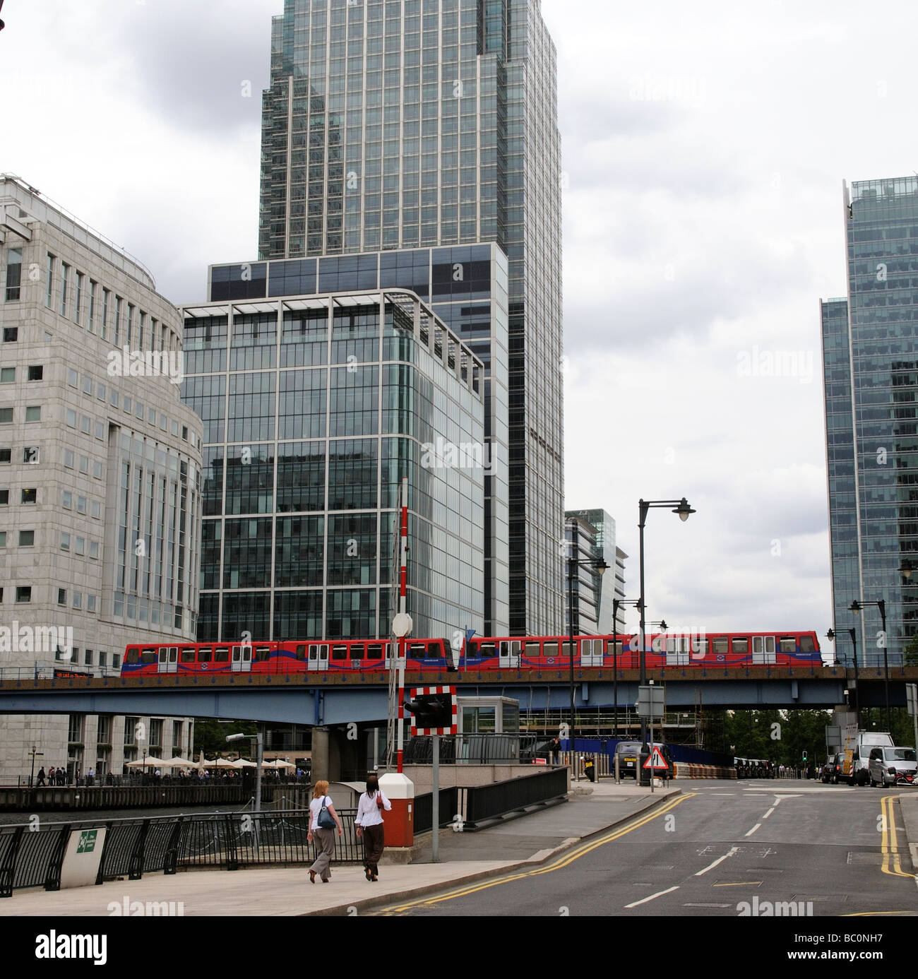 Canary Wharf London UK buildings and a DLR Docklands Light Railway train Stock Photo
