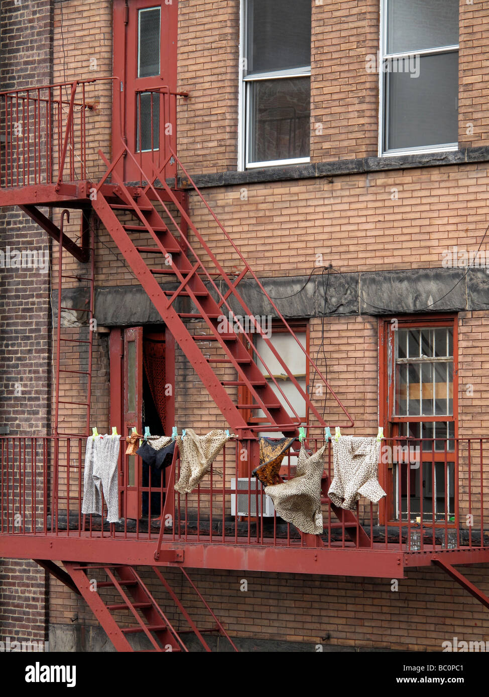 Laundry drying on a New York City fire escape. Stock Photo