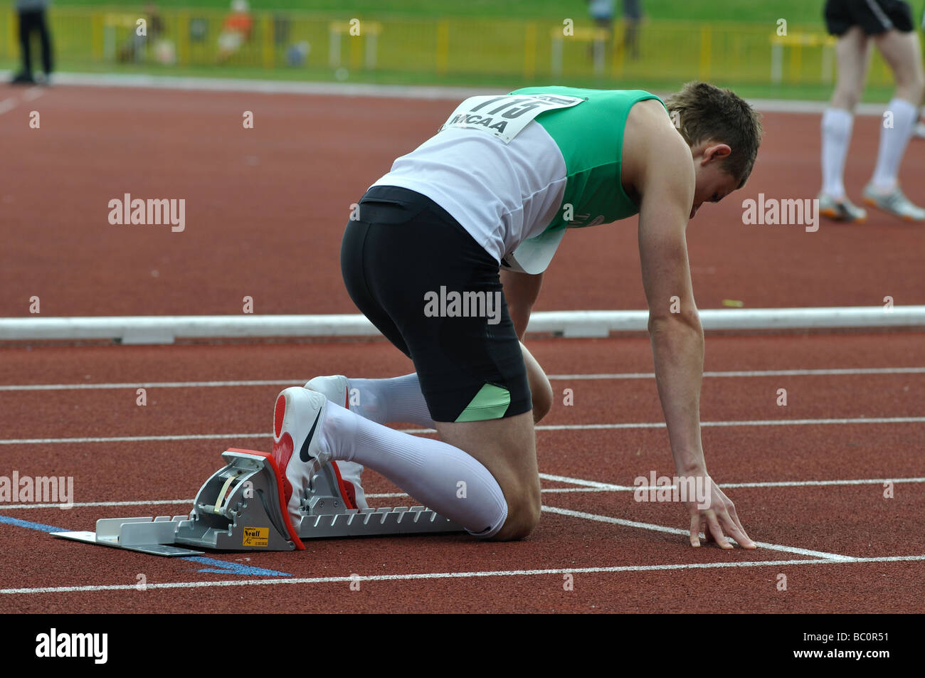 Runner in starting blocks Stock Photo Alamy