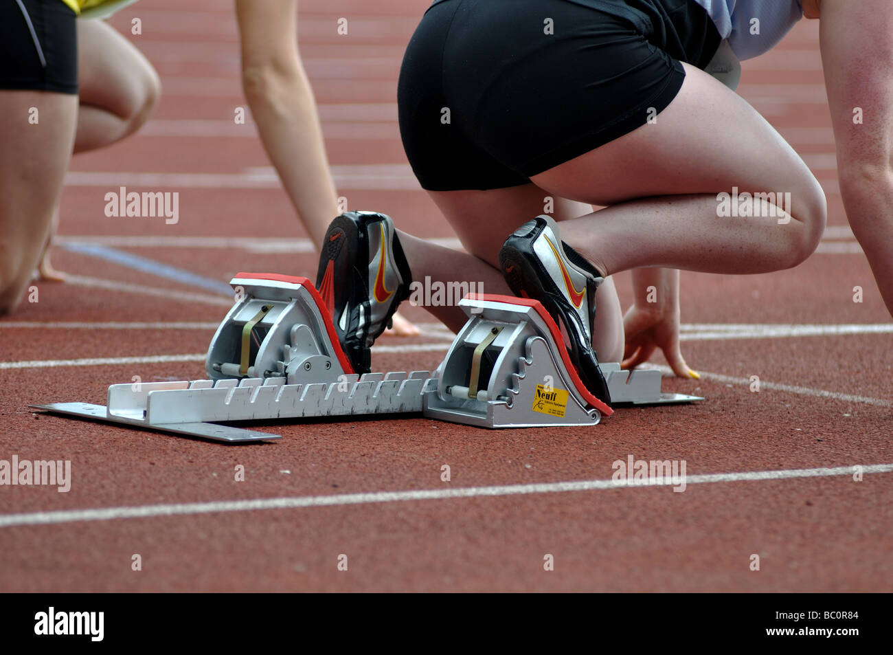 Female athletes in starting blocks hires stock photography and images