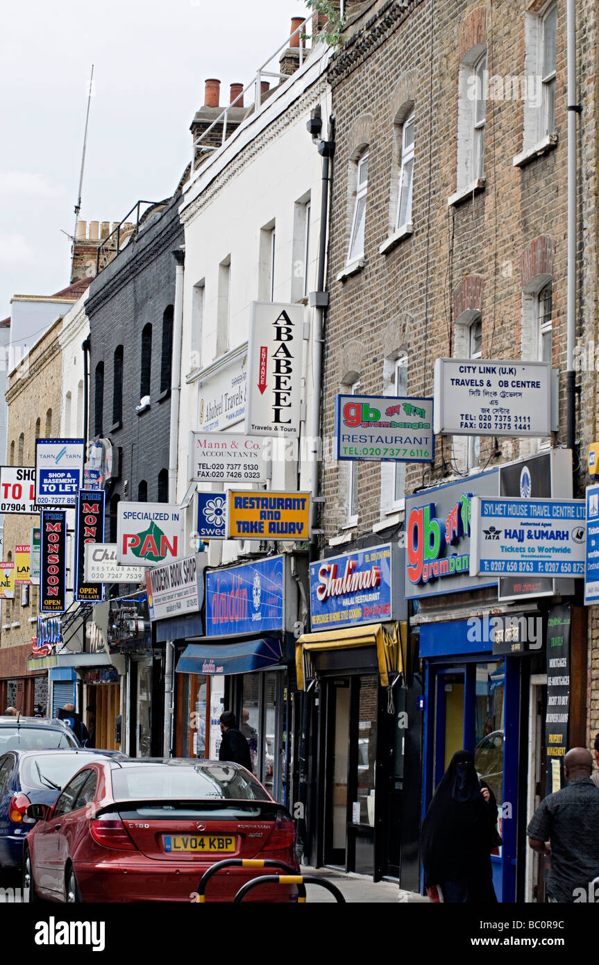 famous curry restaurant signs down brick lane in the east end of london
