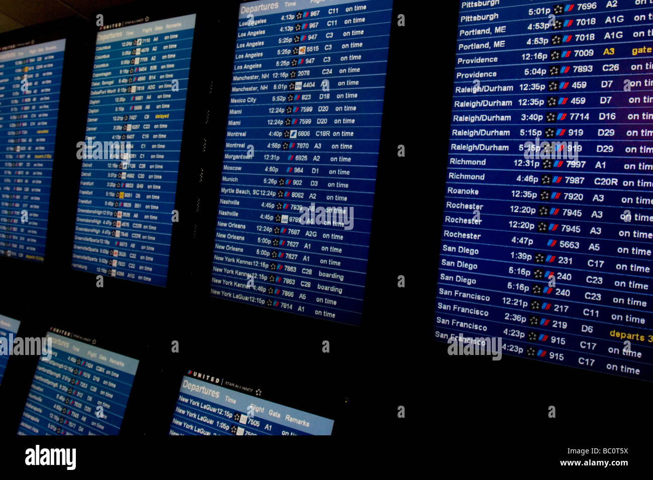 Close up of airline flight departure screens, departure boards, in airport terminal Stock Photo