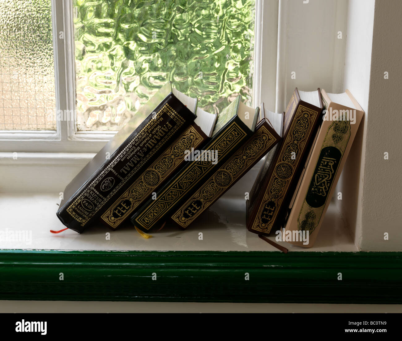 Islamic Books on the Windowsill of Epsom Mosque in the Former St Barnabus Church all Eprom Surrey England Stock Photo