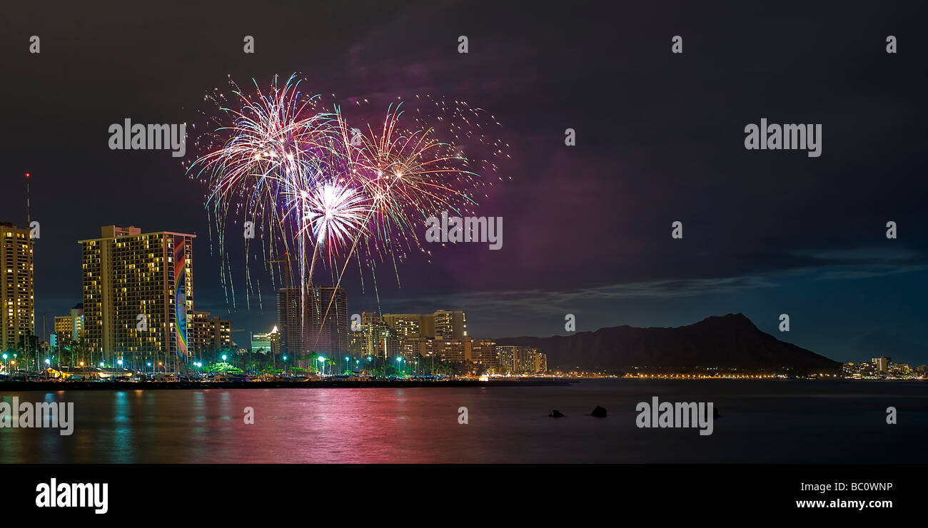Fireworks garnish the Waikiki night skyline with sprouting skyrockets