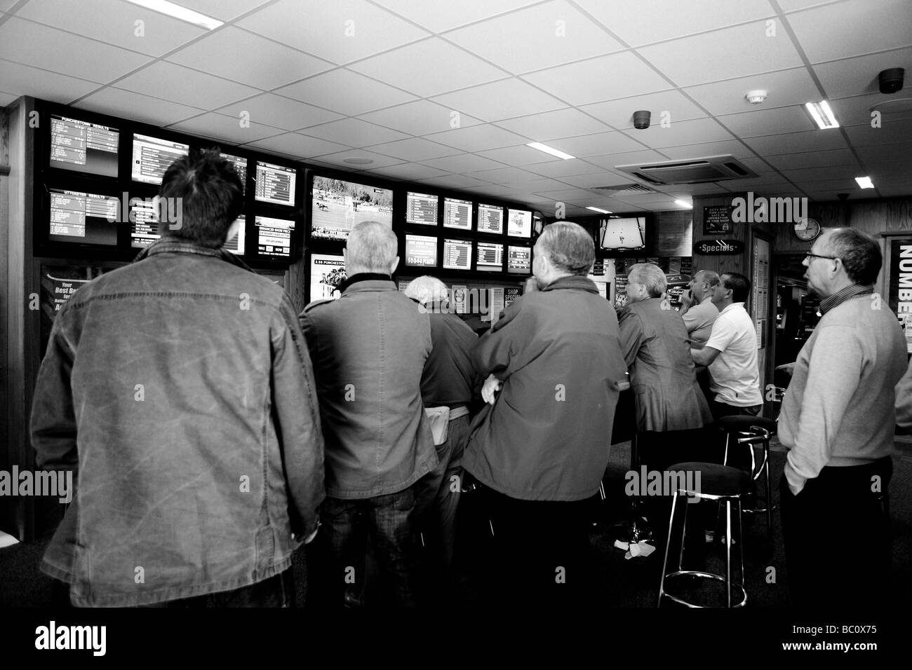 Customers in a betting shop, Belfast, Northern Ireland, United Kingdom, UK, GB Stock Photo