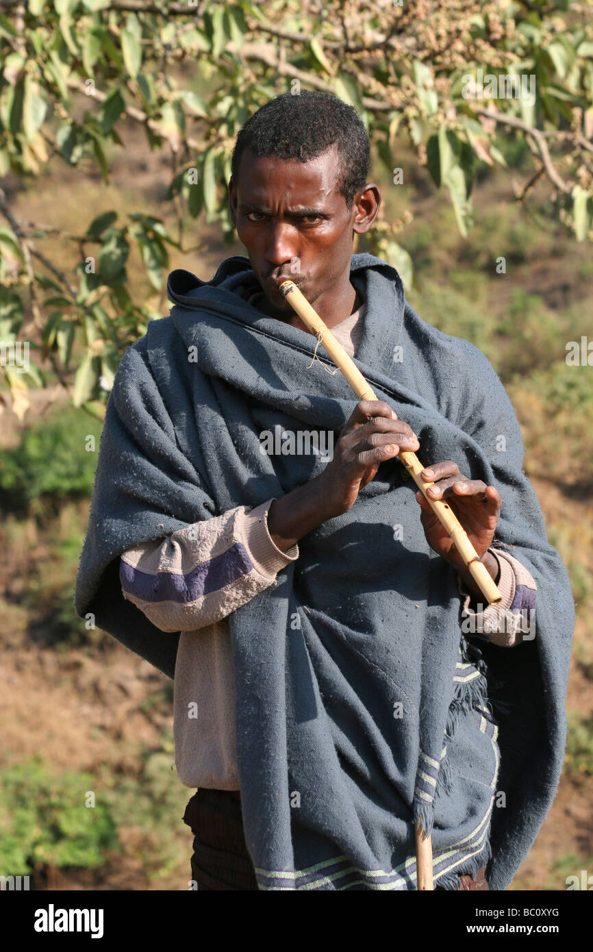 Africa Ethiopia Blue Nile river man playing flute Stock Photo