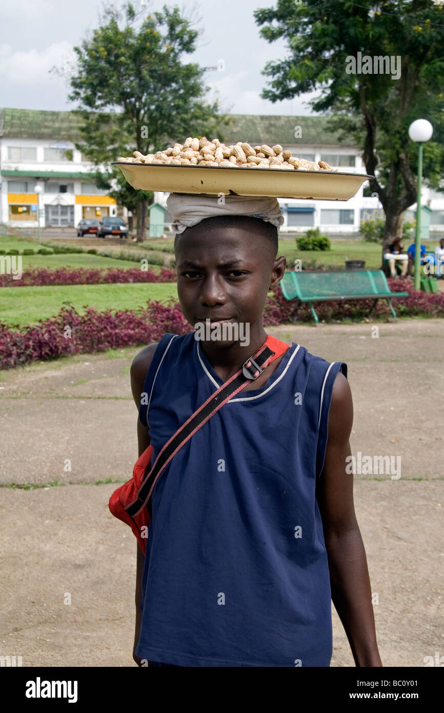 Young boy selling groundnuts in Place du Gouvernement Bonanjo District Douala Cameroon West Africa Stock Photo