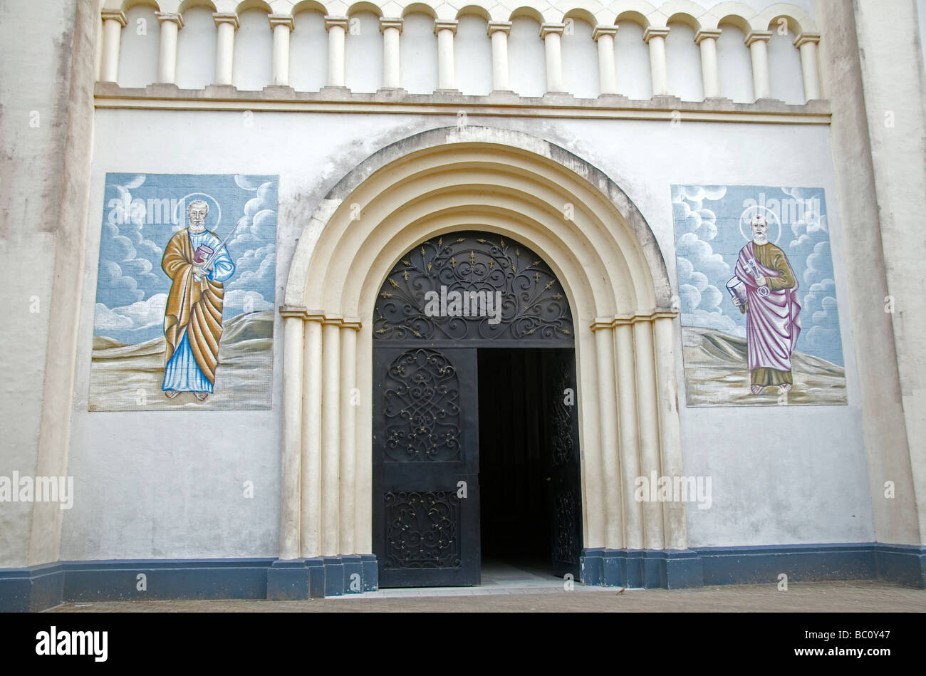 Catholic Cathedral of Saints Peter and Paul Akwa District Douala Cameroon West Africa Entrance door with painted murals Stock Photo