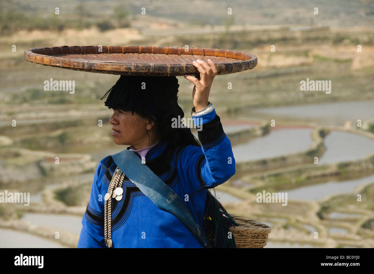 Hani Akha woman with her rice sifting basket in Yuanyang China Stock Photo