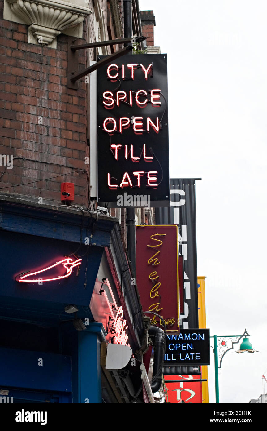 famous curry restaurant signs down brick lane in the east end of london