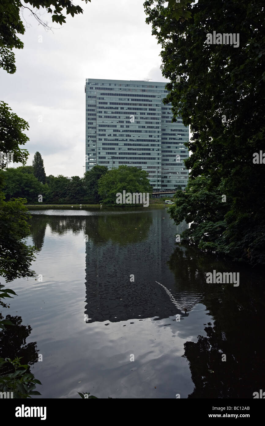 Thyssen Krupp headquarters at Dusseldorf, the 'Dreischeibenhaus', reflected in Hofgarten pond Stock Photo