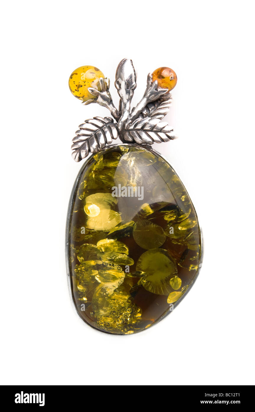 Green amber jewellery piece on white background Stock Photo