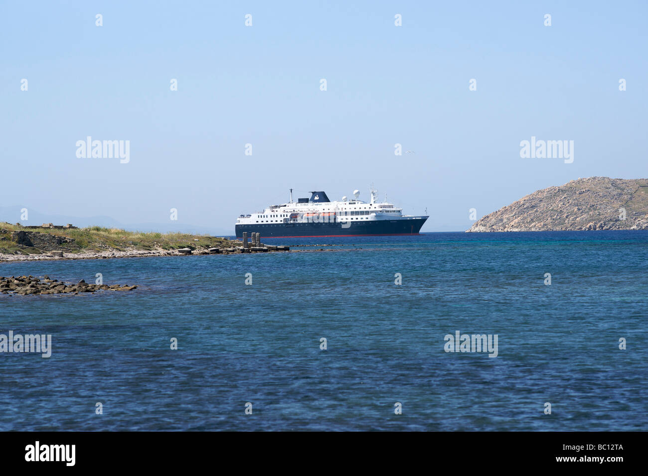 The Swan Hellenic Cruise Ship 'Minerva' visits the Greek Island of Delos. Stock Photo