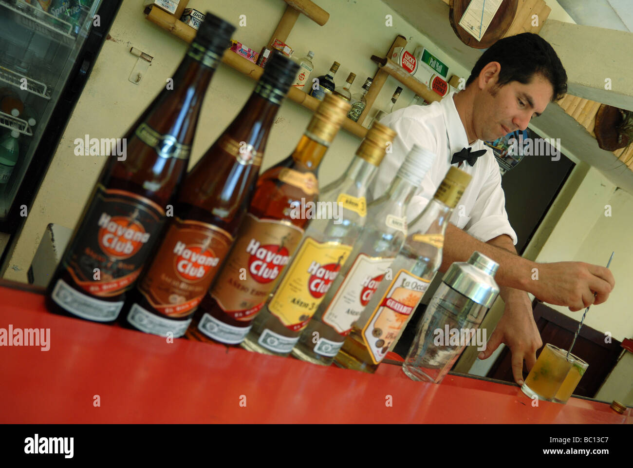 Bartender in Cienfuegos miximg rum cocktails Stock Photo