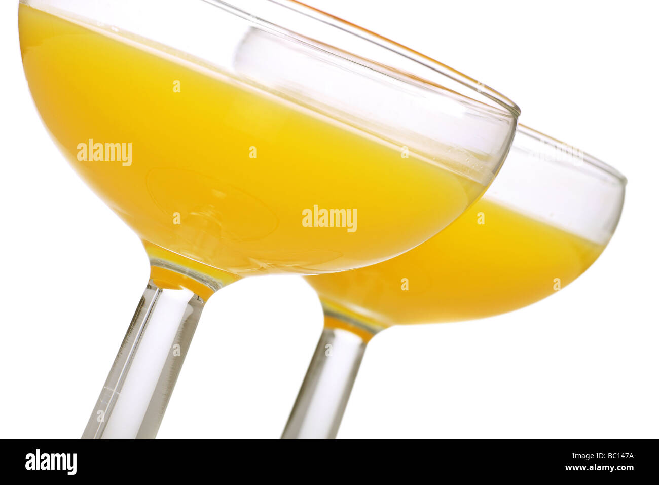 two glasses of bucks fizz served in a cocktail coupe styled glass Stock Photo