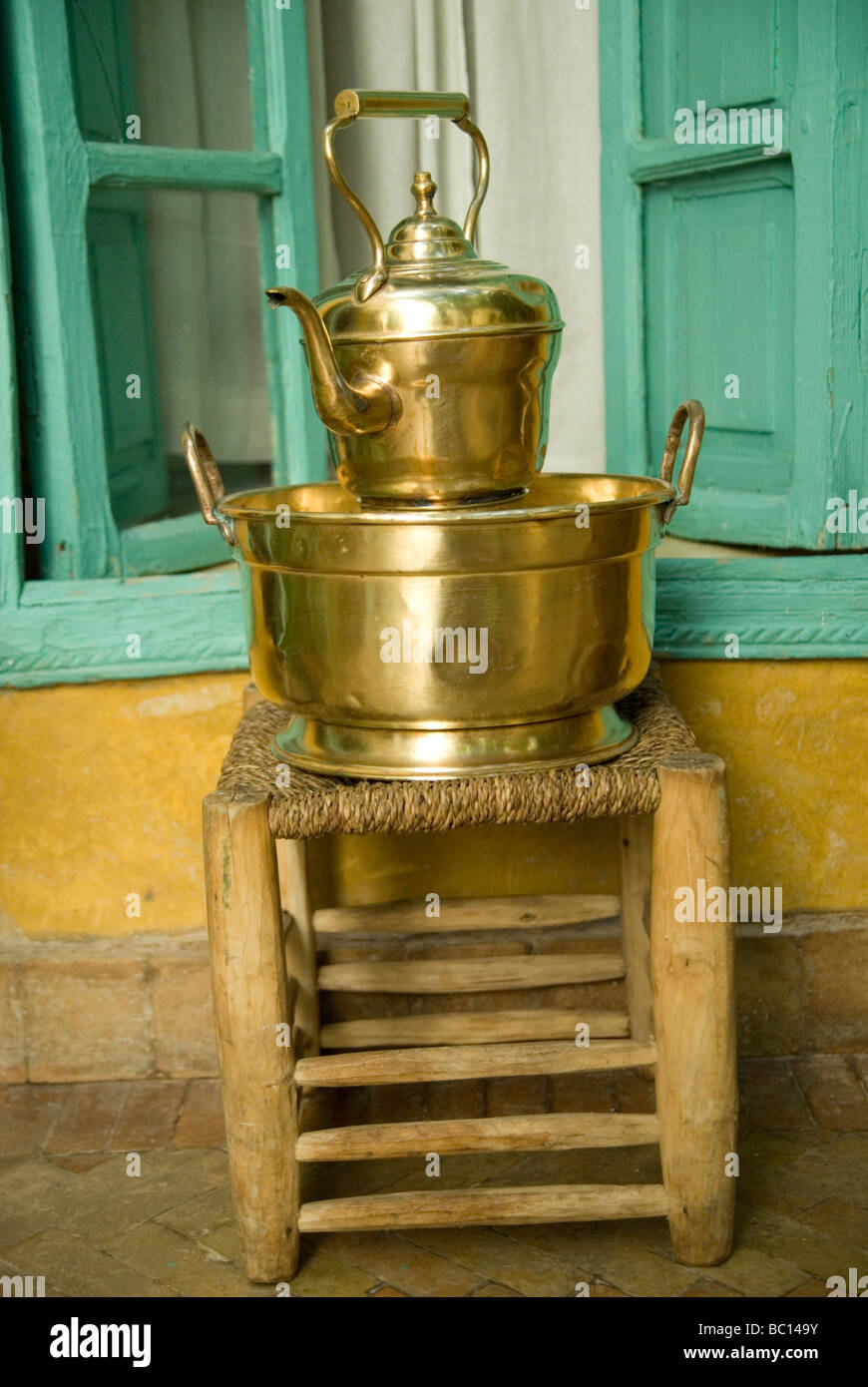 A traditional Morrocan kettle and boiling pan stand inside a Riad in Marrakesh Morocco North Africa Stock Photo