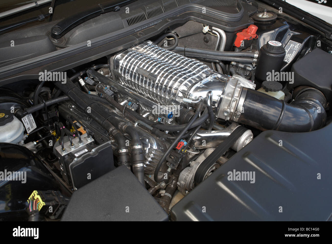 Eaton supercharger mounted to a Chev LS1 V8 engine in an Australian Holden Commodore car Stock Photo