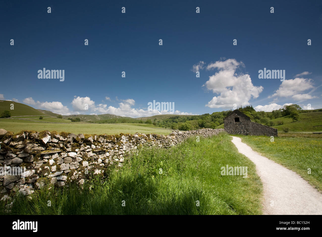 A Path leading to a barn near Malham Yorkshire Dales England Stock Photo