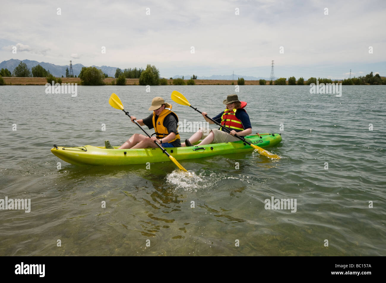 Mother and teenage son kayaking on Wairepo Arm of Lake Ruataniwha, near Twizel Stock Photo
