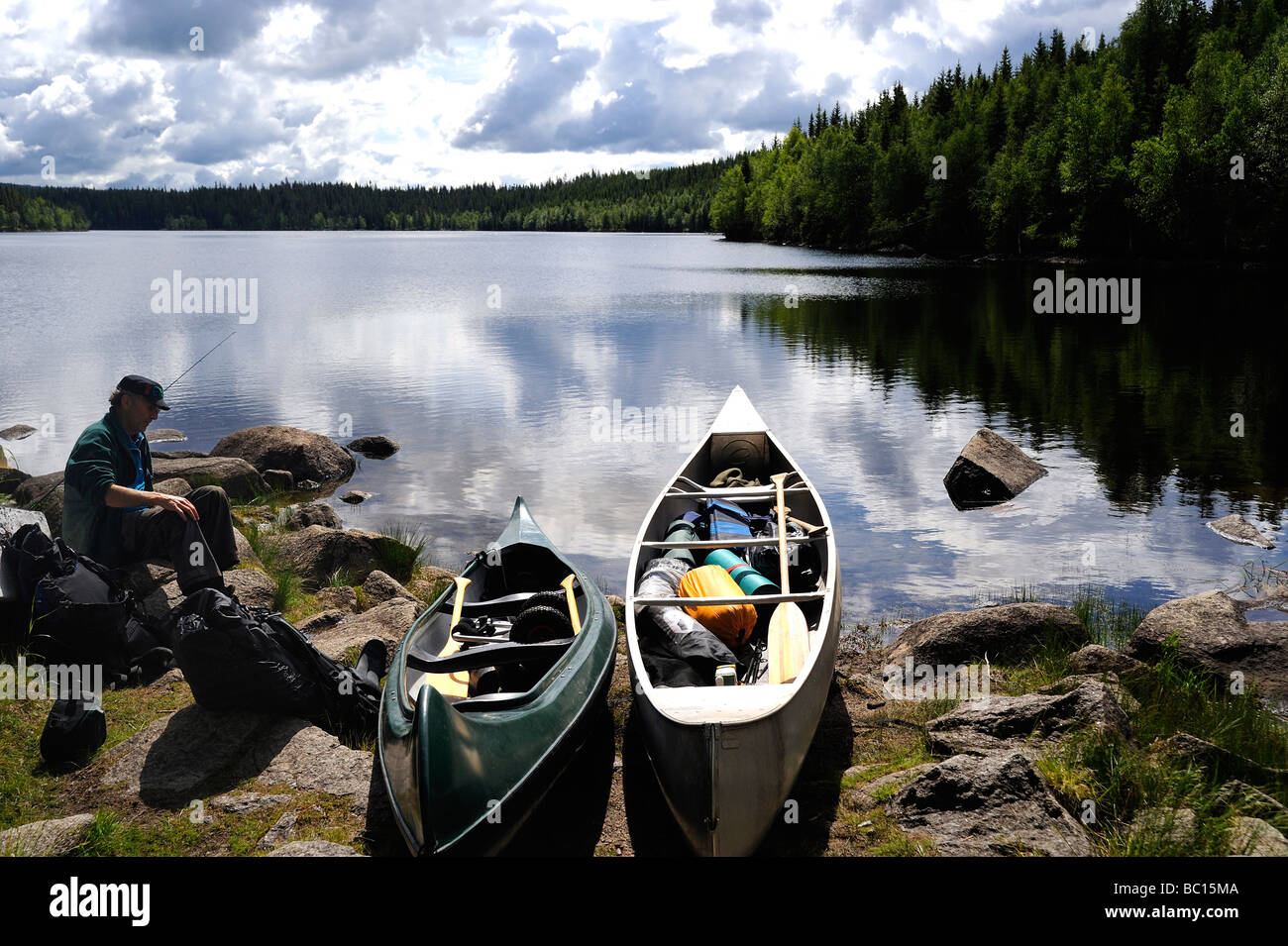 Man sitting on lake hi-res stock photography and images - Alamy