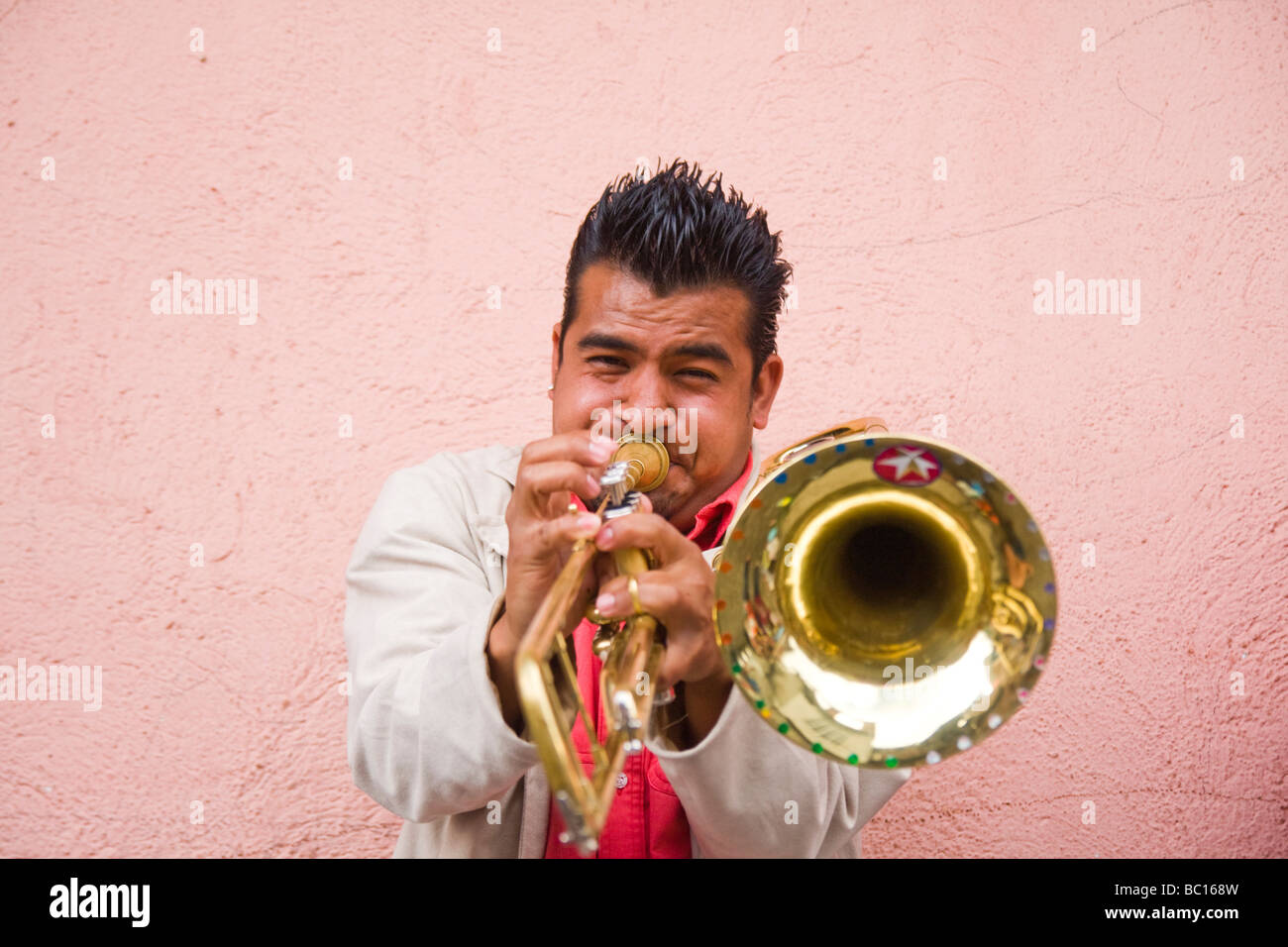 A trombone player performs at a parade in Paracho, Michoacan, Mexico. Stock Photo