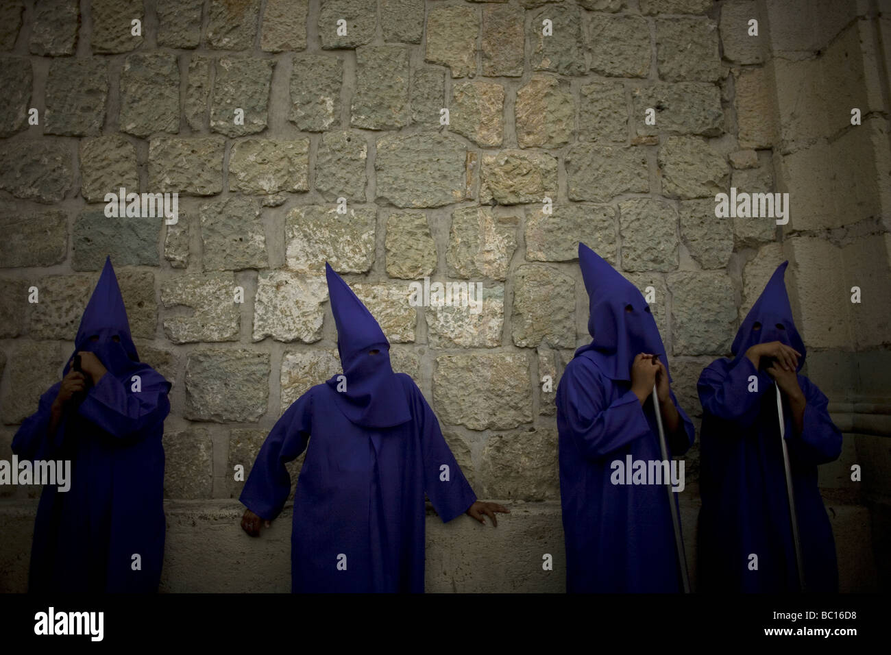 Penitents wait for a holy week procession to start in Oaxaca, Mexico. Stock Photo