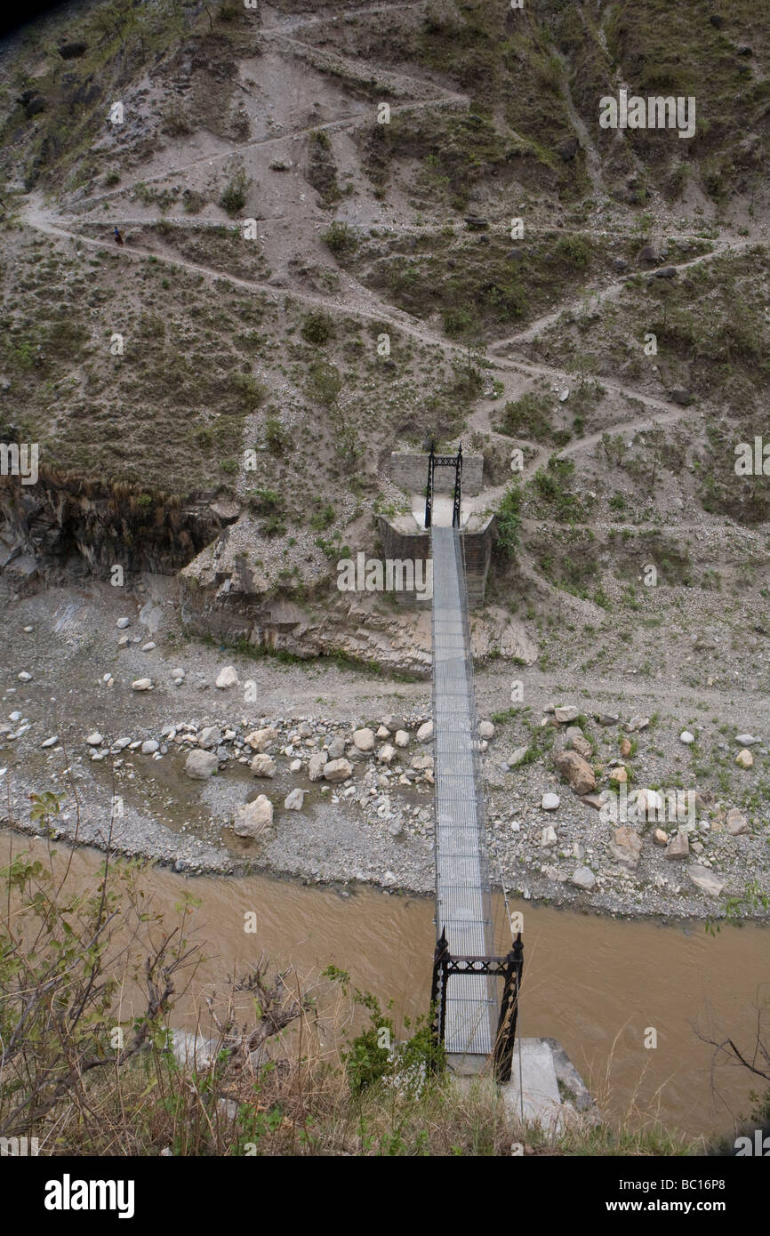 Rosa River with suspension bridge. Kavre, Nepal. Stock Photo