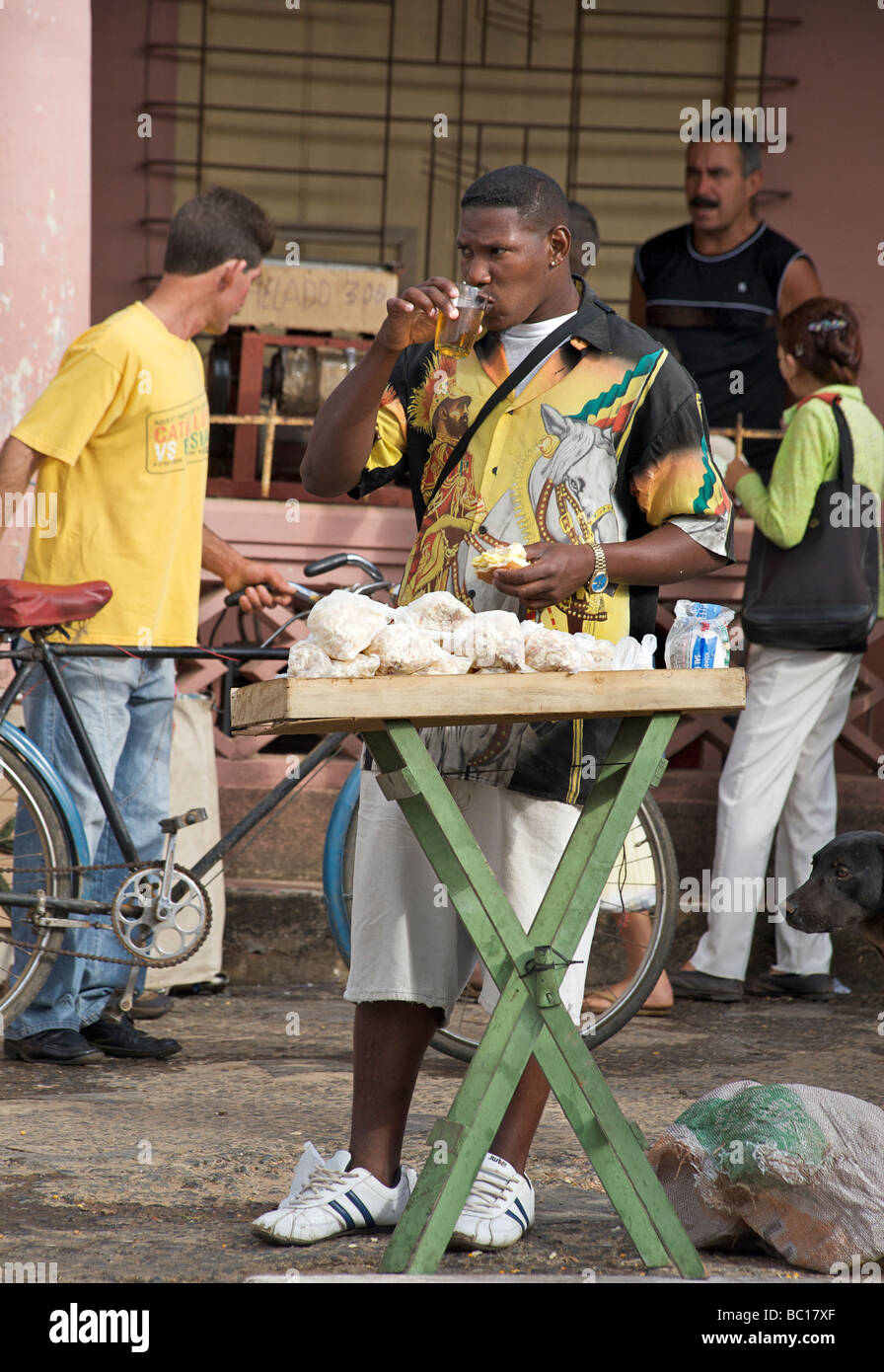 Cuban popcorn vendor drinking at his stall, Viñales Carnival. Cuba