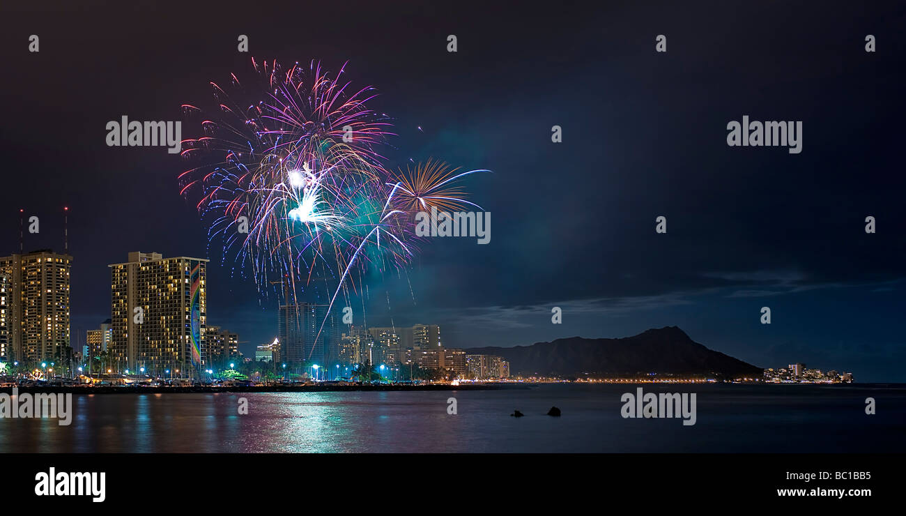 Fireworks garnish the Waikiki night skyline as skyrockets sprout in