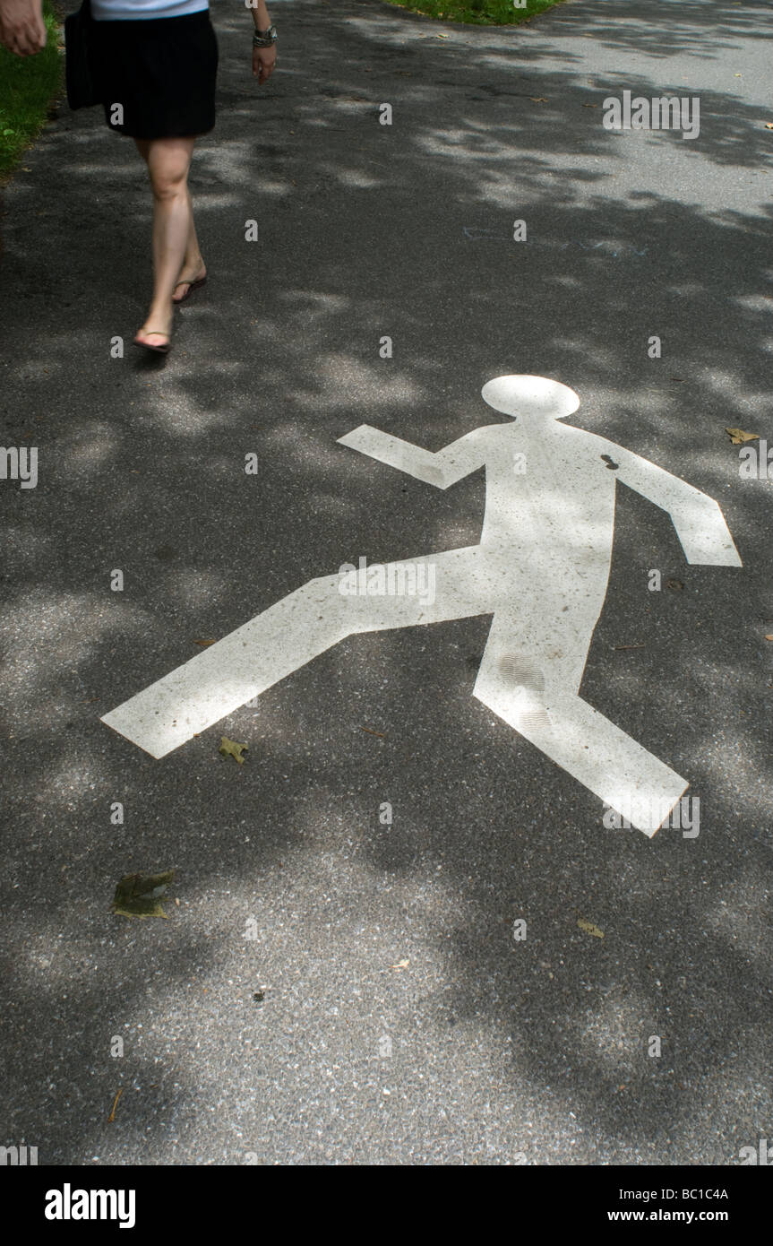 Pedestrian symbol tells pedestrians where to walk in Central Park in New York on Sunday June 20 2009 Frances M Roberts Stock Photo