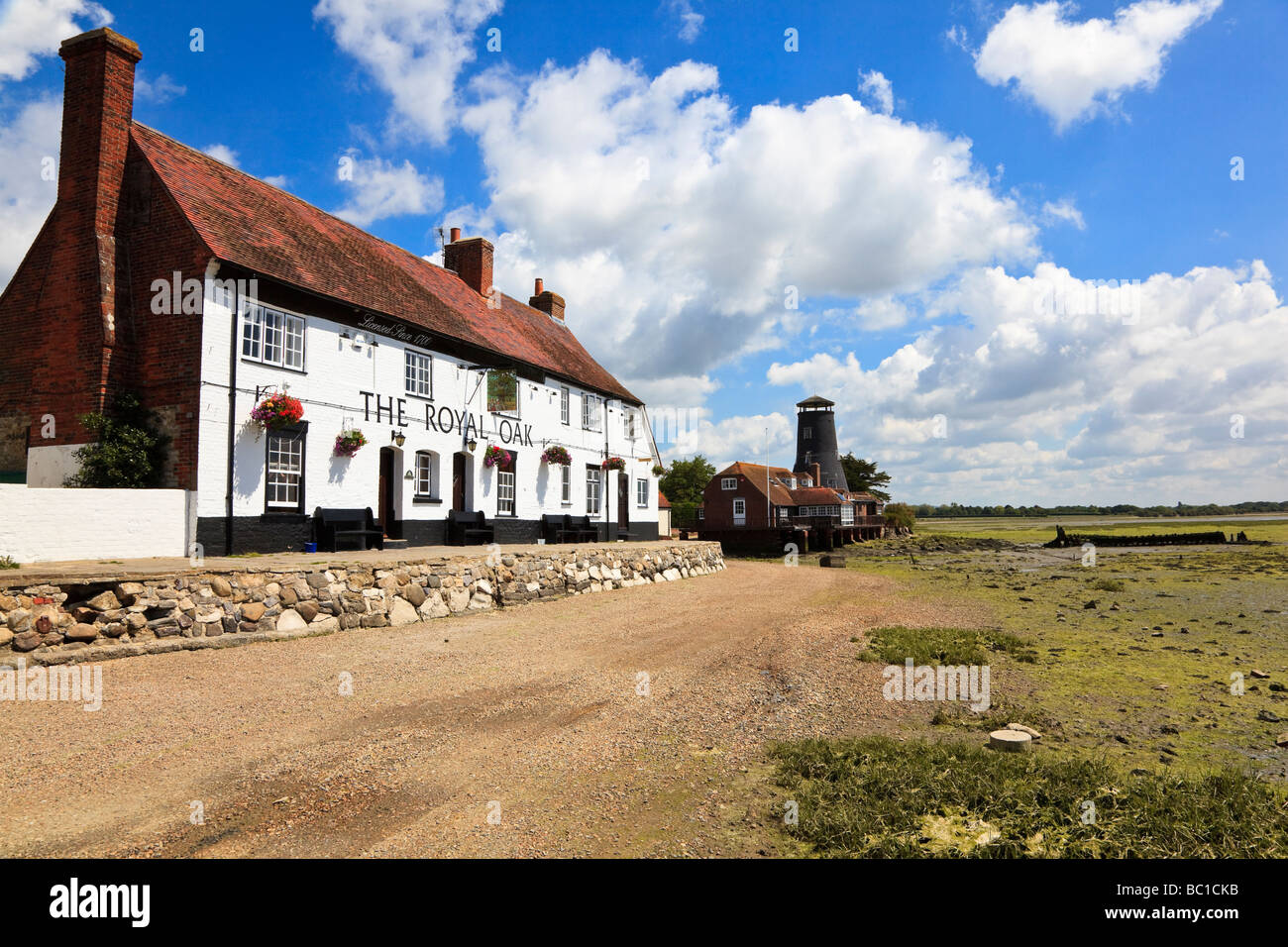 The attractive pub 'The Royal Oak' and Mill in the village of Langstone on the edge of Chichester Harbour Stock Photo