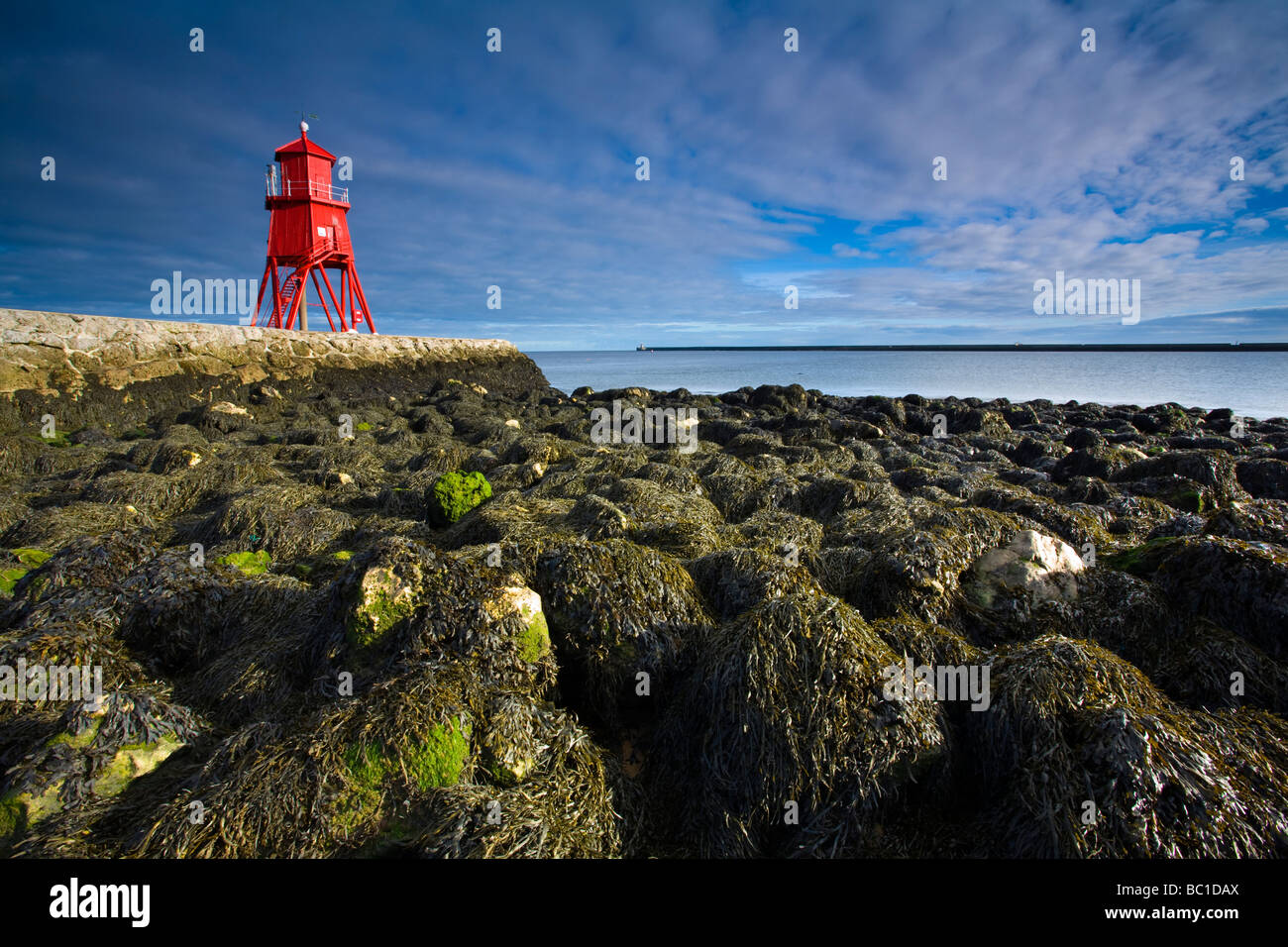 England Tyne Wear South Shields Little Haven Beach looking towards the South Groyne Lighthouse Stock Photo