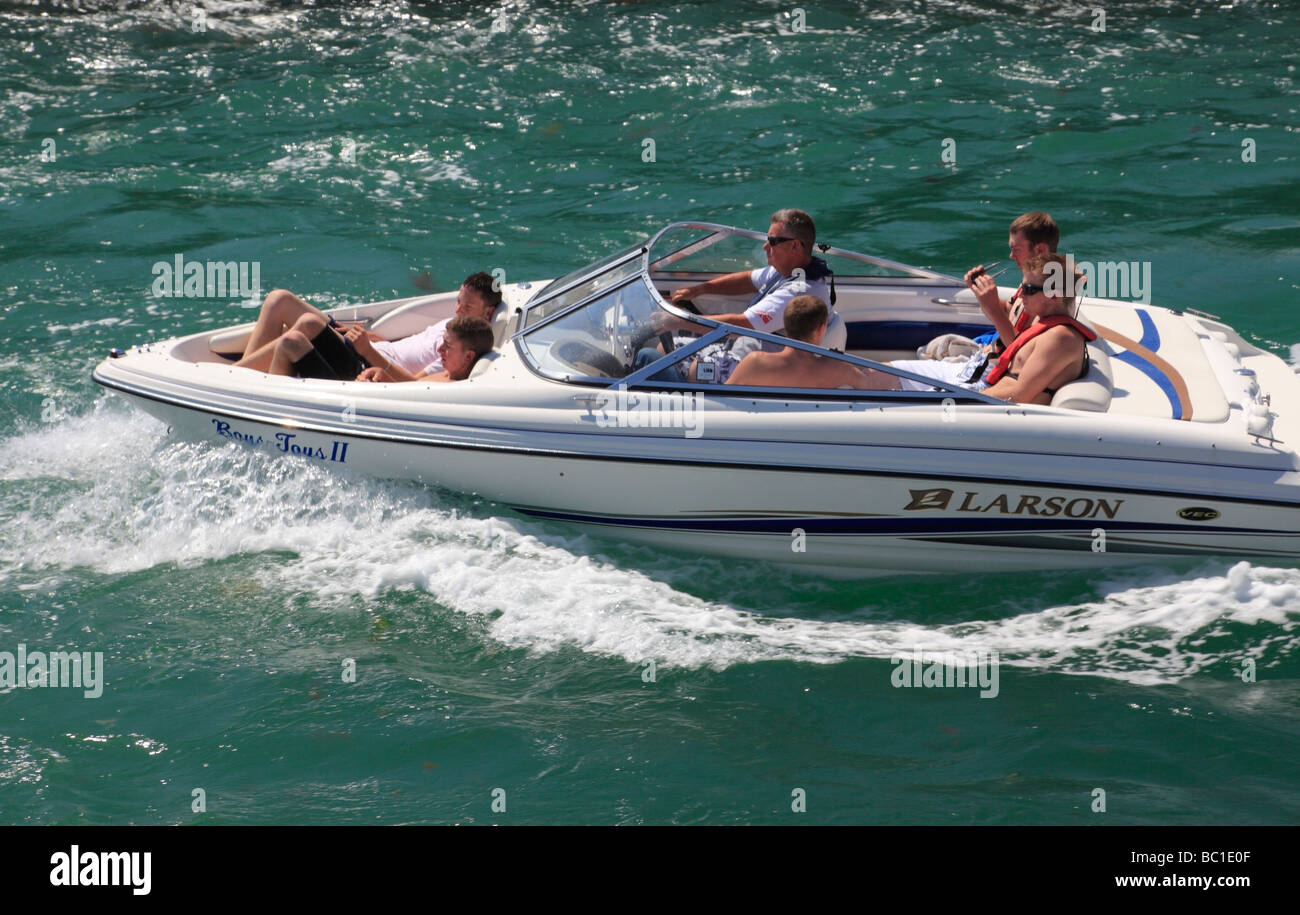 Man and five teenage boys in a speedboat River Arun Littlehampton West Sussex England UK Stock Photo