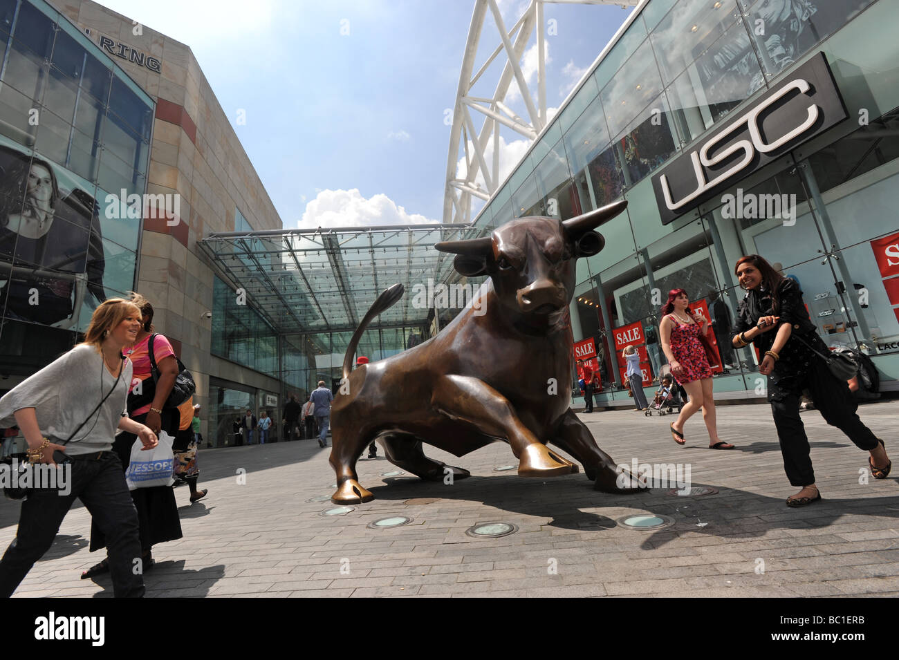 Shoppers at the entrance to the Bullring Shopping Centre in Birmingham England Uk Stock Photo