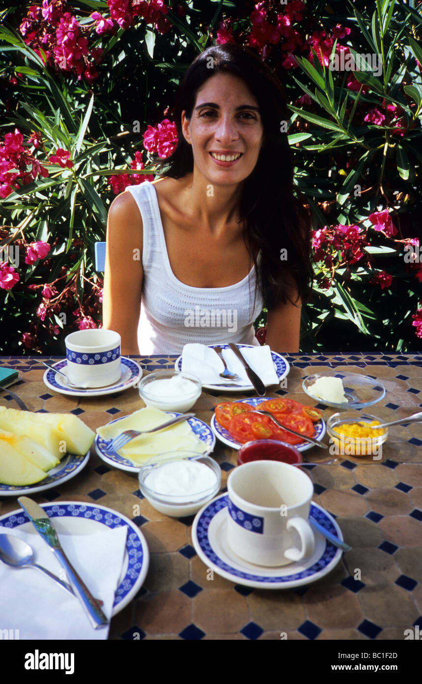 Smiling girl having a healthy breakfast Stock Photo