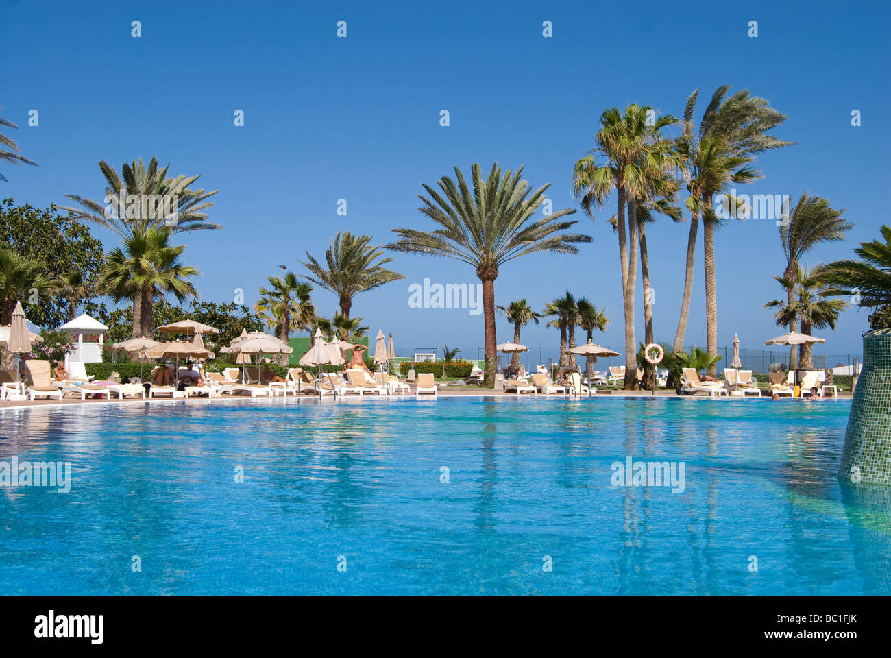 By the pool Stock Photo - Alamy