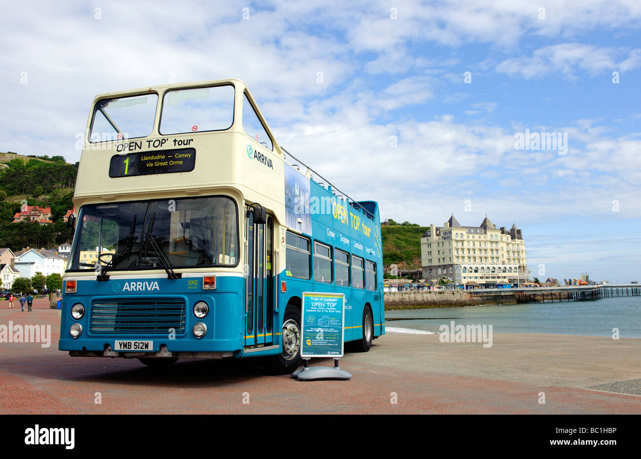 An open top bus on the seafront in Llandudno North Wales Stock Photo